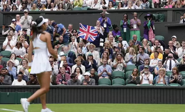 Spectators react during Emma Raducanu of Britain's first round match against Renata Zarazua of Mexico at the Wimbledon tennis championships in London, Monday, July 1, 2024. (AP Photo/Alberto Pezzali)