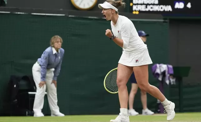 Barbora Krejcikova of the Czech Republic reacts during her fourth round match against Danielle Collins of the United States at the Wimbledon tennis championships in London, Monday, July 8, 2024. (AP Photo/Alberto Pezzali)