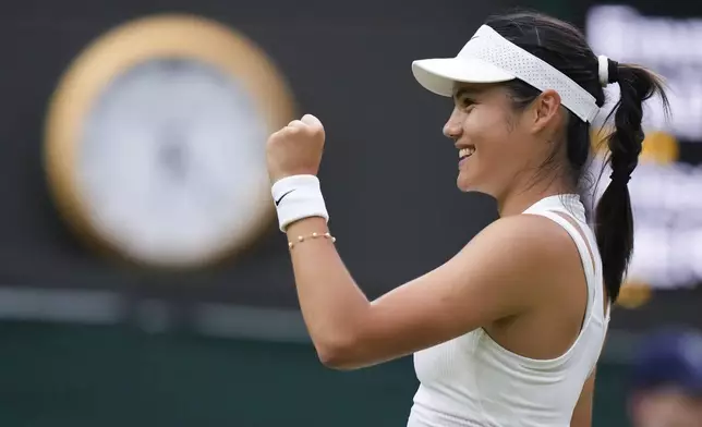 Emma Raducanu of Britain celebrates after defeating Elise Mertens of Belgium in their match on day three at the Wimbledon tennis championships in London, Wednesday, July 3, 2024. (AP Photo/Mosa'ab Elshamy)