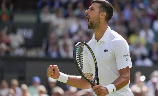 Serbia's Novak Djokovic reacts after winning a point against Britain's Jacob Fearnley during their second round match at the Wimbledon tennis championships in London, Thursday, July 4, 2024. (AP Photo/Kirsty Wigglesworth)