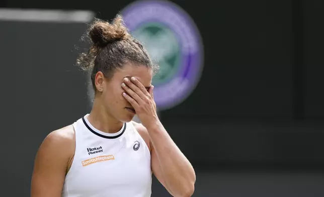 Jasmine Paolini of Italy reacts during her semifinal match against Donna Vekic of Croatia at the Wimbledon tennis championships in London, Thursday, July 11, 2024. (AP Photo/Alberto Pezzali)