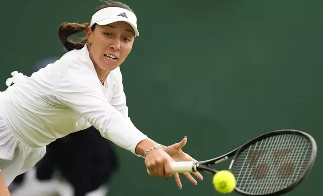 Jessica Pegula of the United States plays a backhand return to compatriot Ashlyn Krueger during their first round match at the Wimbledon tennis championships in London, Tuesday, July 2, 2024. (AP Photo/Alberto Pezzali)