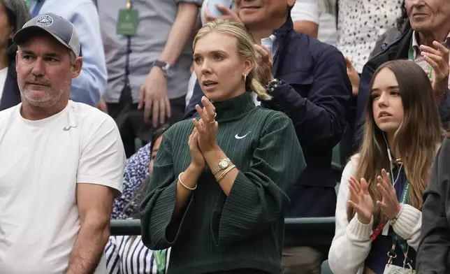 Katie Boulter reacts after watching Alex de Minaur of Australia defeat Arthur Fils of France in their fourth round match at the Wimbledon tennis championships in London, Monday, July 8, 2024. (AP Photo/Alberto Pezzali)