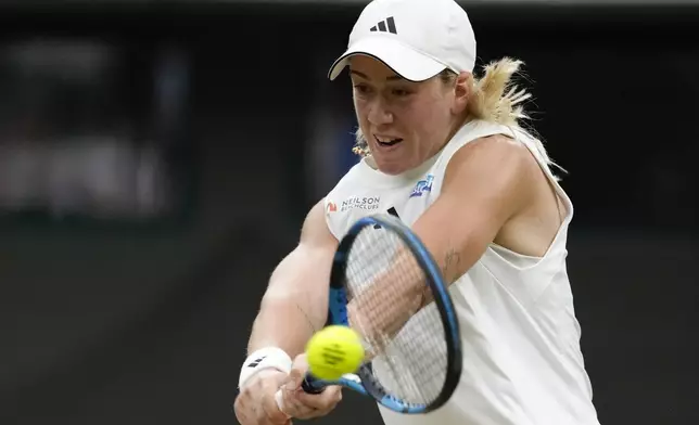 Sonay Kartal of Britain plays a backhand return to Coco Gauff of the United States during their third round match at the Wimbledon tennis championships in London, Friday, July 5, 2024. (AP Photo/Kirsty Wigglesworth)