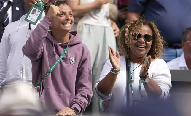 Sara Erani, left, and Jacqueline Paolini, mother of Jasmine react following her semifinal win over Donna Vekic of Croatia at the Wimbledon tennis championships in London, Thursday, July 11, 2024. (AP Photo/Alberto Pezzali)