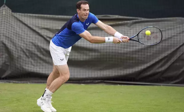 Andy Murray plays a shot during a training session on day two of the 2024 Wimbledon Championships at the All England Lawn Tennis and Croquet Club, London, Tuesday July 2, 2024. (Jordan Pettitt/PA via AP)