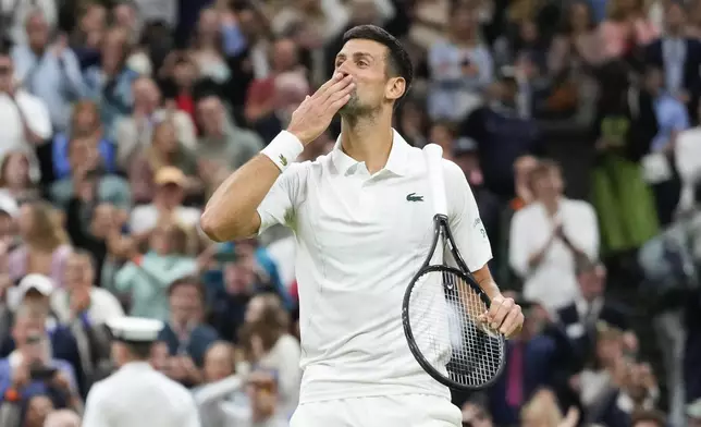 Novak Djokovic of Serbia reacts after defeating Alexei Popyrin of Australia in their third round match at the Wimbledon tennis championships in London, Saturday, July 6, 2024. (AP Photo/Kirsty Wigglesworth)