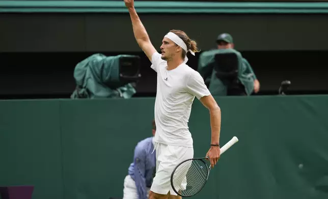 Alexander Zverev of Germany celebrates after defeating Cameron Norrie of Britain in their third round match at the Wimbledon tennis championships in London, Saturday, July 6, 2024. (AP Photo/Kirsty Wigglesworth)