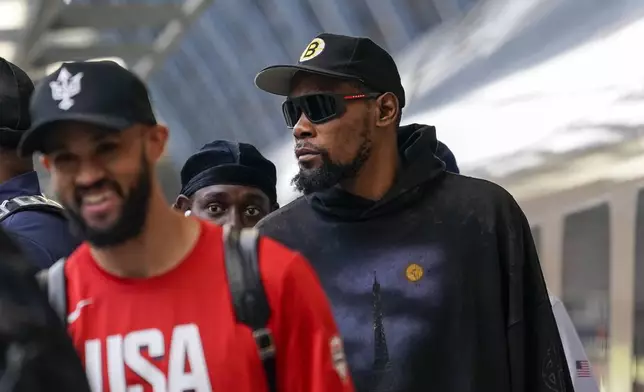 United States' Kevin Durant arrives at St Pancras Station with teammates, to take the Eurostar train as they make their way to the Olympic Games in Paris, in London, Wednesday, July 24, 2024.(AP Photo/Alberto Pezzali)