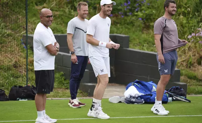 Britain's Andy Murray and his coaching team on the practice court at the All England Lawn Tennis and Croquet Club in Wimbledon, London, Saturday June 29, 2024. The Wimbledon Championships begin on July 1. (John Walton/PA via AP)