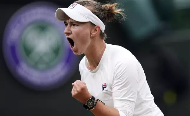 Barbora Krejcikova of the Czech Republic reacts during a fourth round match against to Danielle Collins of the United States at the Wimbledon tennis championships in London, Monday, July 8, 2024. (John Walton/PA via AP)