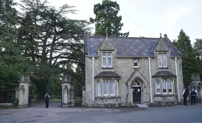 A view of the entrance to Lavender cemetery in Enfield, north London where triple murder suspect Kyle Clifford, 26, was found by officers on Wednesday afternoon, July 10, 2024. British police said they found Wednesday the man suspected of killing the wife and two daughters of a well-known BBC radio commentator near London in a brutal crossbow attack. (Jonathan Brady/PA via AP)