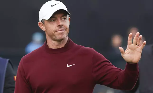 Rory McIlroy of Northern Ireland waves as he walks off the 18th green following his second round of the British Open Golf Championships at Royal Troon golf club in Troon, Scotland, Friday, July 19, 2024. (AP Photo/Scott Heppell)