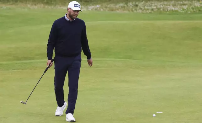 Daniel Brown of England reacts on the 18th green during his final round of the British Open Golf Championships at Royal Troon golf club in Troon, Scotland, Sunday, July 21, 2024. (AP Photo/Scott Heppell)