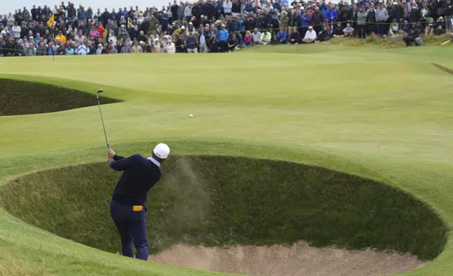 Daniel Brown of England plays from a bunker on the fourth hole during his final round of the British Open Golf Championships at Royal Troon golf club in Troon, Scotland, Sunday, July 21, 2024. (AP Photo/Jon Super)