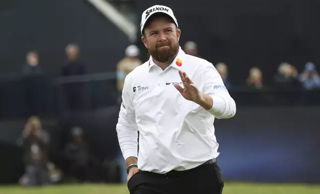 Shane Lowry of Ireland waves as he walks from the 18th green following his second round of the British Open Golf Championships at Royal Troon golf club in Troon, Scotland, Friday, July 19, 2024. (AP Photo/Scott Heppell)