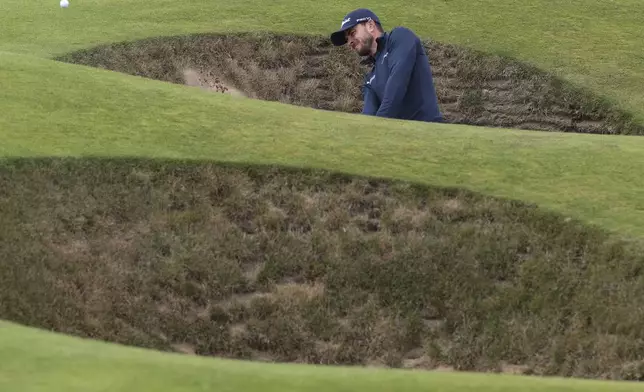 Laurie Canter of England plays from a bunker on the fifth hole during his final round of the British Open Golf Championships at Royal Troon golf club in Troon, Scotland, Sunday, July 21, 2024. (AP Photo/Scott Heppell)