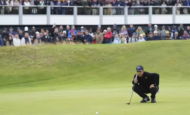 Xander Schauffele of the United States lines up his putt on the 16th green during his final round of the British Open Golf Championships at Royal Troon golf club in Troon, Scotland, Sunday, July 21, 2024. (AP Photo/Jon Super)