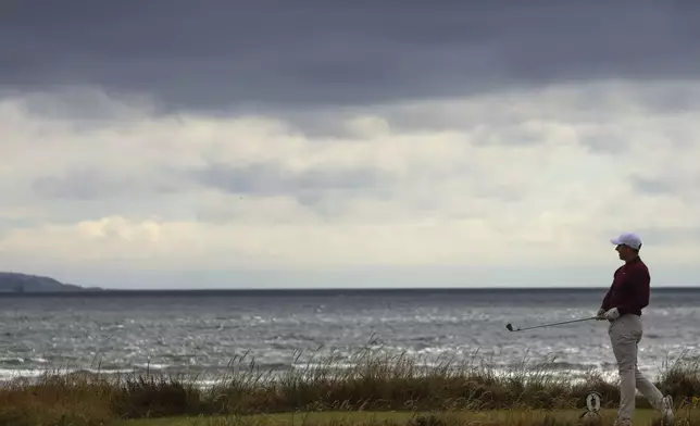 Rory McIlroy of Northern Ireland watches his tee shot on the fifth hole during his second round of the British Open Golf Championships at Royal Troon golf club in Troon, Scotland, Friday, July 19, 2024. (AP Photo/Peter Morrison)