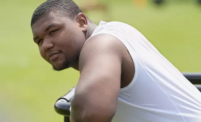 Cleveland Browns defensive tackle Mike Hall Jr. waits for his turn to speak at a news conference during an NFL football training camp practice Saturday, July 27, 2024, in White Sulphur Springs, W.Va. (AP Photo/Sue Ogrocki)