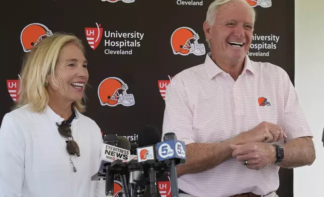 Cleveland Browns owners Dee and Jimmy Haslam laugh during a news conference at an NFL football training camp practice, Saturday, July 27, 2024, in White Sulphur Springs, W.Va. (AP Photo/Sue Ogrocki)