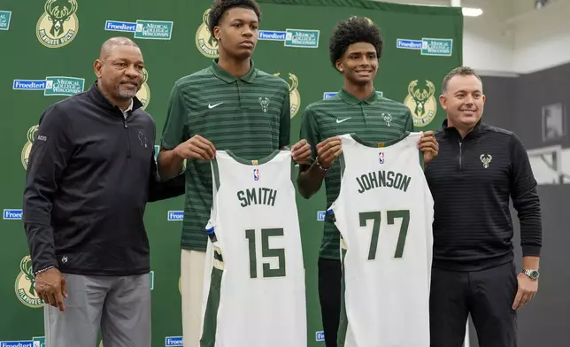 Milwaukee Bucks 2024 draft picks AJ Johnson and Tyler Smith pose for a picture with head coach Doc Rivers and general manager Jon Horst at a news conference Tuesday, July 2, 2024, in Milwaukee. (AP Photo/Morry Gash)