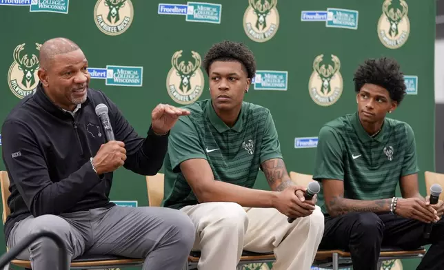 Milwaukee Bucks 2024 draft picks AJ Johnson and Tyler Smith listen to head coach Doc Rivers at a news conference Tuesday, July 2, 2024, in Milwaukee. (AP Photo/Morry Gash)