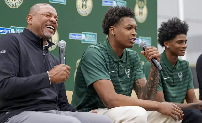 Milwaukee Bucks 2024 draft picks AJ Johnson and Tyler Smith laugh with head coach Doc Rivers at a news conference Tuesday, July 2, 2024, in Milwaukee. (AP Photo/Morry Gash)