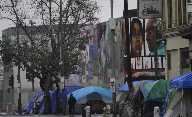 FILE - Tents are set up outside of Emmanuel Baptist Rescue Mission on Monday, Feb. 5, 2024, in Los Angeles. California Gov. Gavin Newsom issued an executive order Thursday, July 25, for the removal of homeless encampments in the state. (AP Photo/Damian Dovarganes, File)