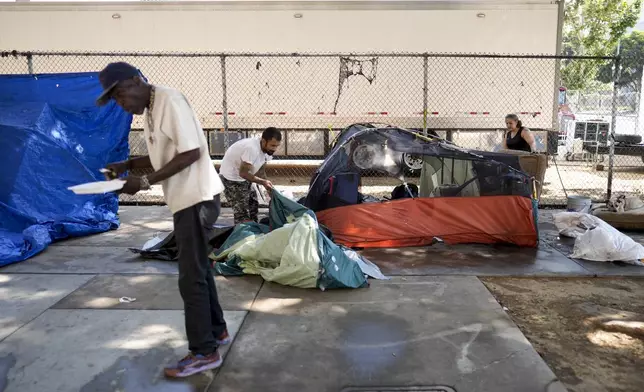 Tents are set up at an encampment Thursday, July 25, 2024, in Los Angeles. California Gov. Gavin Newsom issued an executive order Thursday to direct state agencies on how to remove homeless encampments, a month after a Supreme Court ruling allowing cities to enforce bans on sleeping outside in public spaces. (AP Photo/Jae C. Hong)