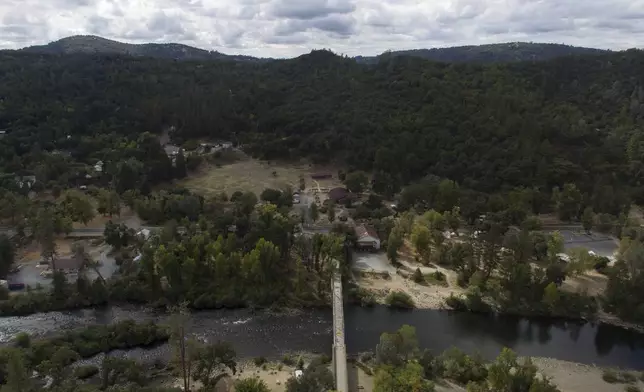 The South Fork of American River flows alongside Marshall Gold Discovery State Historic Park, Tuesday, Oct. 10, 2023, in Coloma, Calif. (AP Photo/Godofredo A. Vásquez)