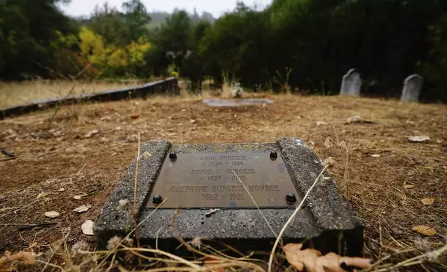 A tombstone for ancestors of the Burgess family is seen at the Marshall Gold Discovery State Historic Park cemetery Tuesday, Oct. 10, 2023, in Coloma, Calif. (AP Photo/Godofredo A. Vásquez)