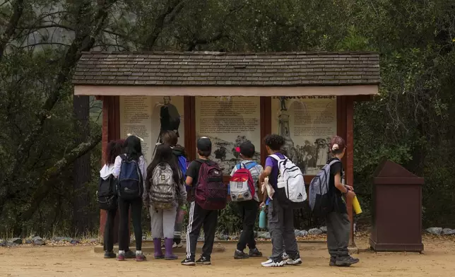 Children visit Marshall Gold Discovery State Historic Park, Tuesday, Oct. 10, 2023, in Coloma, Calif. (AP Photo/Godofredo A. Vásquez)