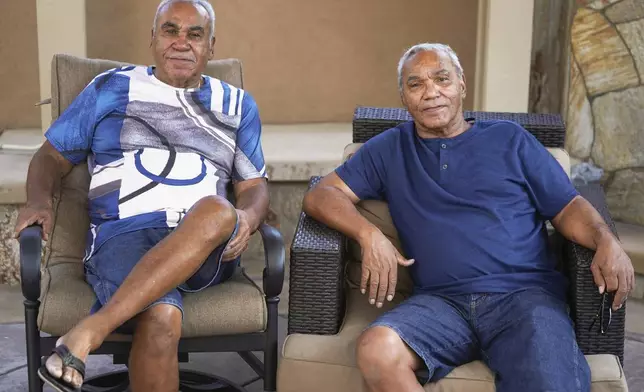 Descendants of Nelson Bell, Milford Fonza, left, and his brother, Elmer Fonza pose for a picture at Milford's home in Glendora, Calif., on Friday, Sept. 8, 2023. Bell was a black gold miner and land owner who lived in Coloma, Calif., from 1850 until his death in 1869. The land once owned by Bell is now part of a California State Park. They believe that we have been denied the generational wealth that their family may have been entitled to if given our rightful inheritance, the land once owned by Nelson Bell. (AP Photo/Damian Dovarganes)