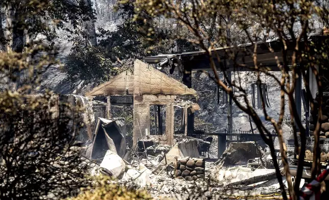 Walls stand at a residence destroyed by the Park Fire on Sycamore Valley Rd. near Chico, Calif., on Thursday, July 25, 2024. (AP Photo/Noah Berger)