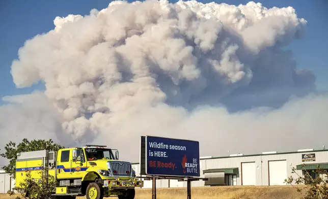 Seen from Chico, Calif., a plume rises from the Park Fire burning in Butte County on Thursday, July 25, 2024. (AP Photo/Noah Berger)