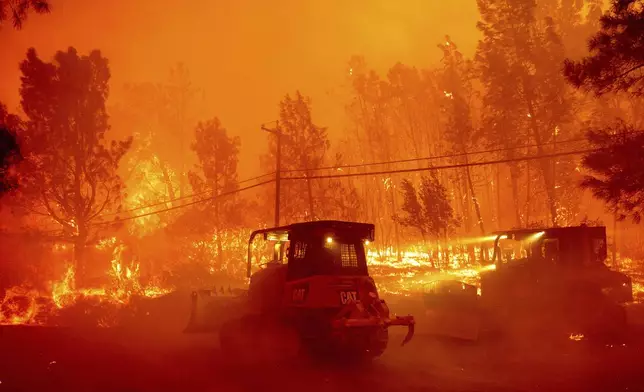 A hillside burns as the Park Fire tears though the Cohasset community in Butte County, Calif., on Thursday, July 25, 2024. (AP Photo/Noah Berger)