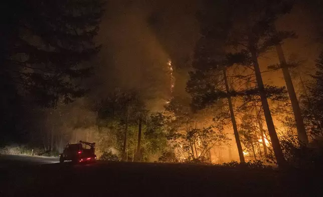 The Park Fire burns along Highway 32 near Butte Meadows, Calif., Sunday, July 28, 2024. (AP Photo/Nic Coury)