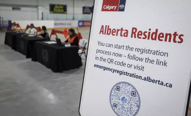 A reception center is readied for wildfire evacuees forced from Jasper National Park in Calgary, Alberta, Canada, Tuesday, July 23, 2024. (Jeff McIntosh/The Canadian Press via AP)