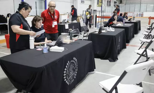 A reception center is readied for wildfire evacuees forced from Jasper National Park in Calgary, Alberta, Canada, Tuesday, July 23, 2024. (Jeff McIntosh/The Canadian Press via AP)