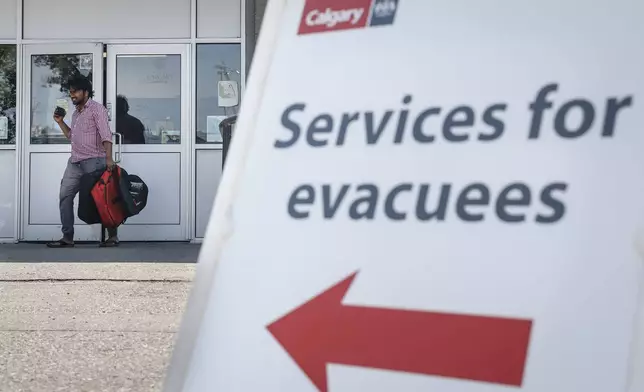 A reception centre is readied for wildfire evacuees forced from Jasper National Park in Calgary, Alta., Tuesday, July 23, 2024. (Jeff McIntosh/The Canadian Press via AP)