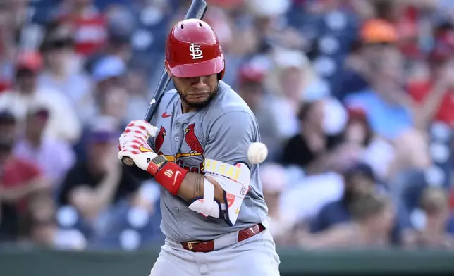 St. Louis Cardinals' Willson Contreras is hit by a pitch from Washington Nationals reliever Joan Adon during the ninth inning of a baseball game, Monday, July 8, 2024, in Washington. (AP Photo/Nick Wass)