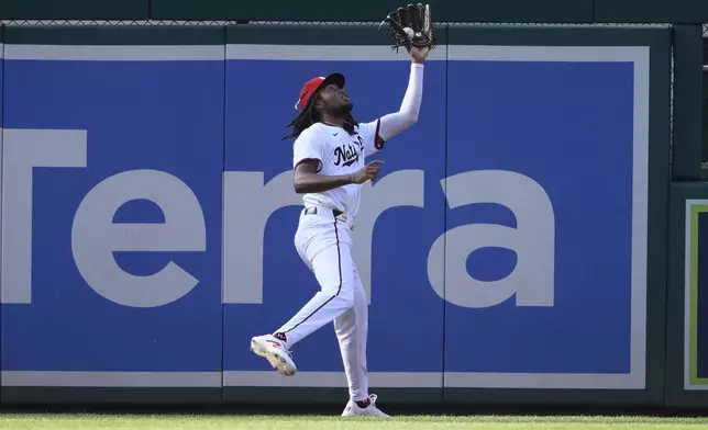 Washington Nationals left fielder James Wood catches a fly ball hit by St. Louis Cardinals' Masyn Winn for an out during the seventh inning of a baseball game, Monday, July 8, 2024, in Washington. (AP Photo/Nick Wass)