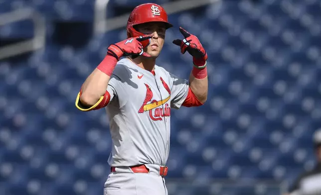 St. Louis Cardinals' Lars Nootbaar gestures at first base after he singled during the fourth inning of a baseball game against the Washington Nationals, Monday, July 8, 2024, in Washington. (AP Photo/Nick Wass)