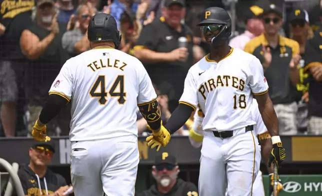 Pittsburgh Pirates' Rowdy Tellez, left, is greeted by Michael A. Taylor after hitting a solo home run during the fourth inning of a baseball game against the St. Louis Cardinals in Pittsburgh, Wednesday, July 24, 2024. (AP Photo/Justin Berl)