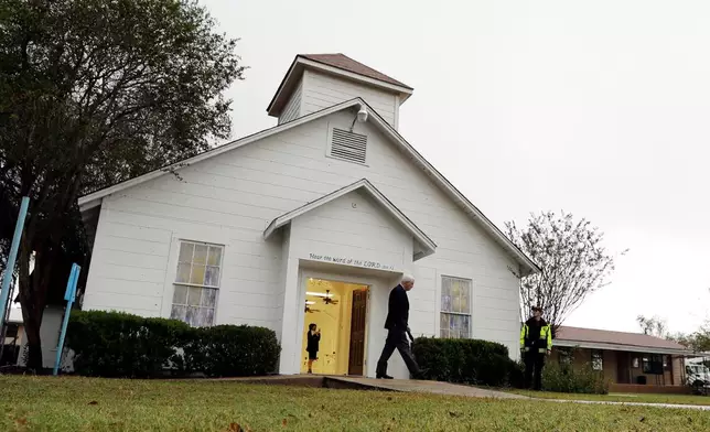 FILE - A man walks out of the memorial for the victims of a shooting at Sutherland Springs First Baptist Church in Sutherland Springs, Texas, on Nov. 12, 2017. After the shooting on Nov. 5, in which 26 people were killed and 20 others were wounded, the church was repaired and turned into a memorial sanctuary. (AP Photo/Eric Gay, File)