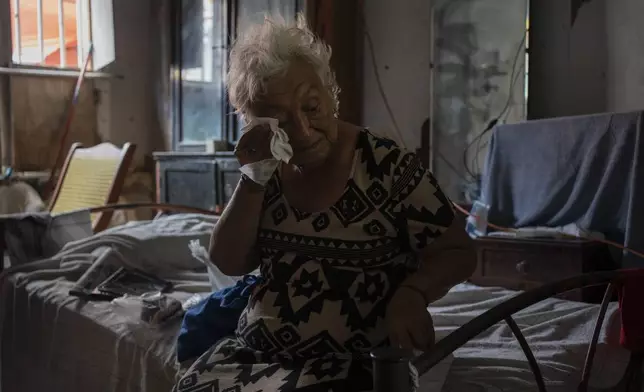 FILE - Margarita Salazar, 82, wipes the sweat off with a tissue inside her home in Veracruz, Mexico on June 16, 2024. June 2024 was the hottest June on record, according to Europe's Copernicus climate service on Monday, July 8. (AP Photo/Felix Marquez, File)