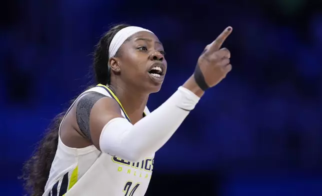 FILE - Dallas Wings' Arike Ogunbowale instructs teammates during a WNBA basketball game against the Minnesota Lynx in Arlington, Texas, June 27, 2024. The Wings were coming off their most successful season in Texas, with All-Star starters Satou Sabally and Ogunbowale among the core back from a team that made the WNBA semifinals. Sabally got hurt even before the season, the first of numerous injuries that have clipped the Wings, who are now just trying to hold on until the Olympic break. (AP Photo/Tony Gutierrez, File)