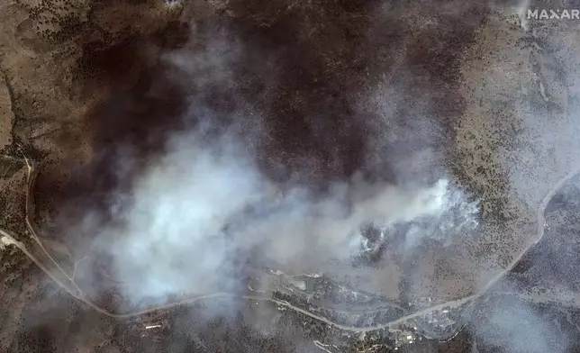 This satellite image provided by Maxar Technologies shows the fire line near Big Thompson Road for the Alexander Mountain Fire burning west of Loveland, Colo., Tuesday, July 30, 2024. (Satellite image ©2024 Maxar Technologies via AP)