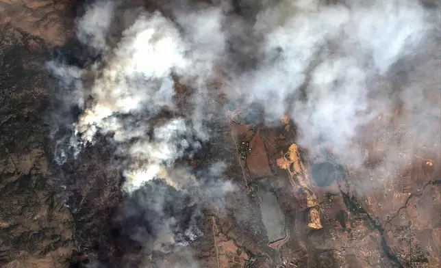 This satellite image provided by Maxar Technologies shows the Alexander Mountain Fire burning west of Loveland, Colo., Tuesday, July 30, 2024. (Satellite image ©2024 Maxar Technologies via AP)